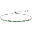 White gold emerald tennis bracelet in 14K gold with adjustable chain